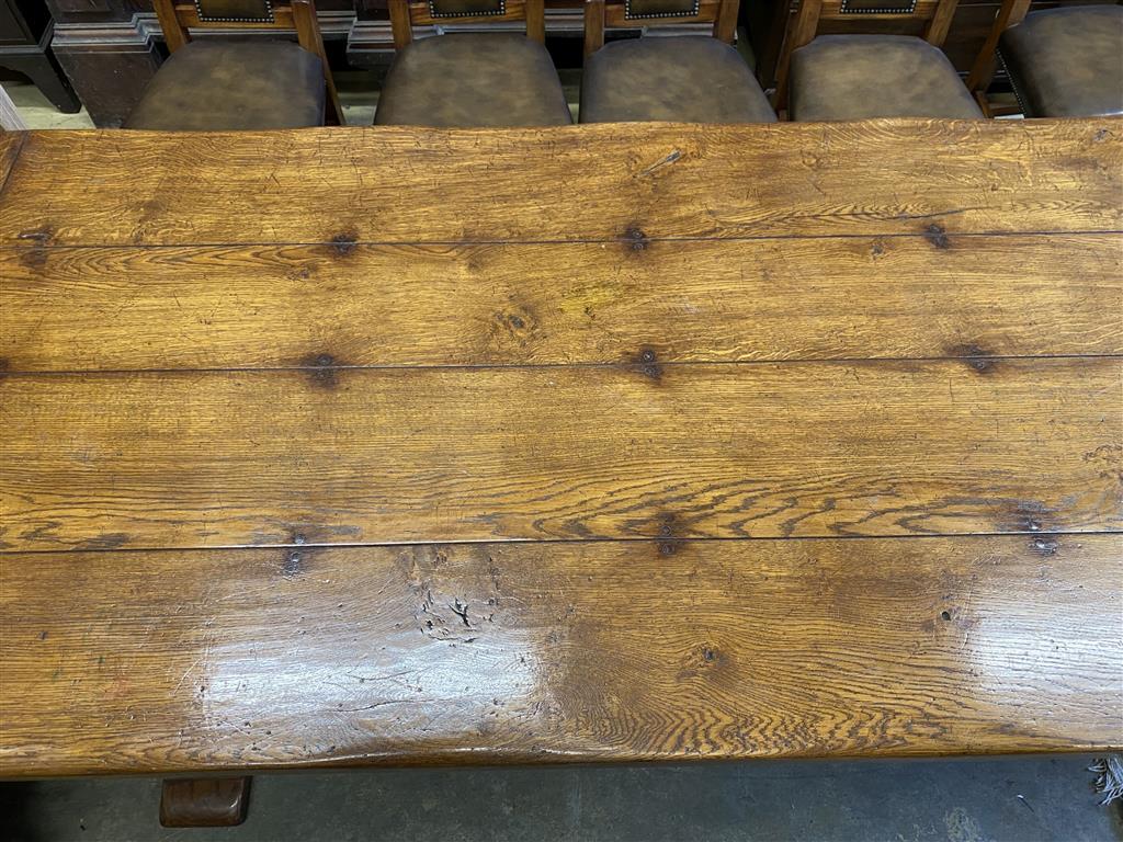 An 18th century style rectangular oak refectory dining table, length 274cm, depth 106cm, height 76cm